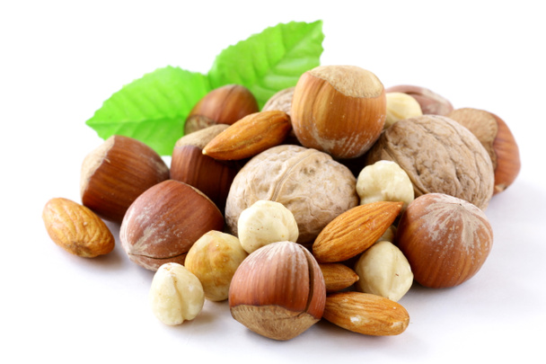 Mix nuts - walnuts, hazelnuts, almonds on a white background - Photo, Image