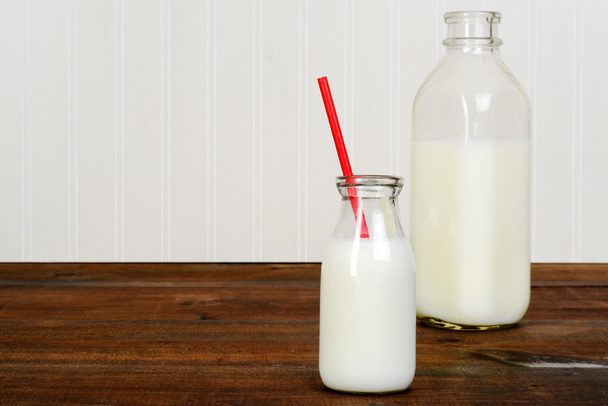 fresh glass of milk with bottle - Foto, Imagem