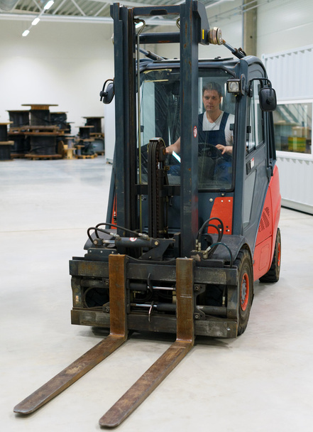 Handsome forklift operator working in the warehouse. - Photo, Image