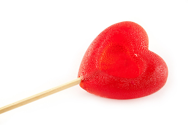 Valentine day concept - Sugar candy in the form of a heart it is isolated on white background. - Foto, Bild