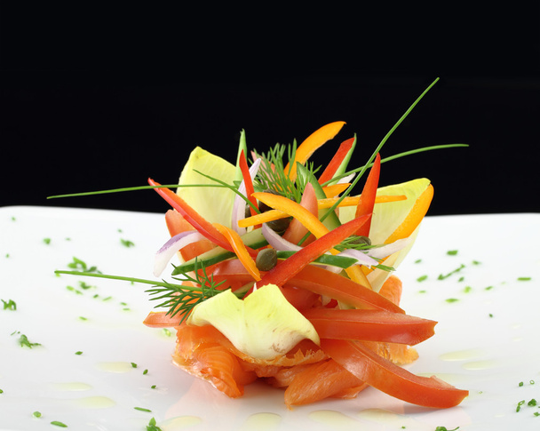 Gourmet dish. Smoked salmon with vegetables - Photo, Image