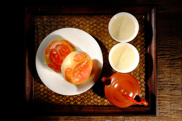 Té chino caliente y postres
 - Foto, imagen