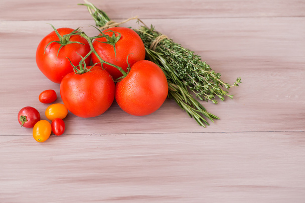 Collection tomato on a wooden background. - Foto, Imagen