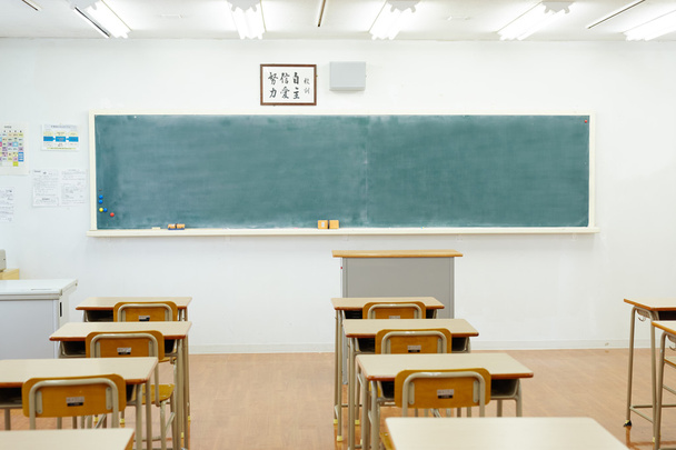 School classroom with school desks and blackboard - Foto, Imagen