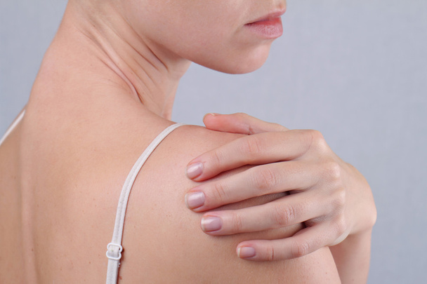 Acute pain in a woman shoulder. Pain relief concept - Fotografie, Obrázek