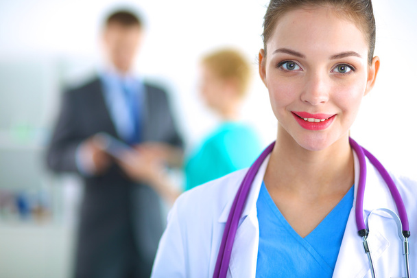 Woman doctor standing with folder at hospital - Fotografie, Obrázek