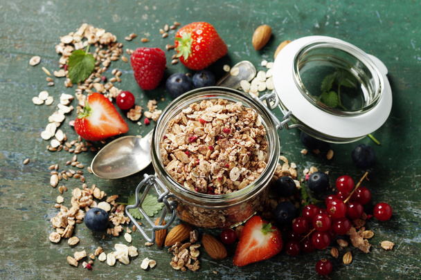 Healthy breakfast of muesli, berries with yogurt and seeds - Photo, image
