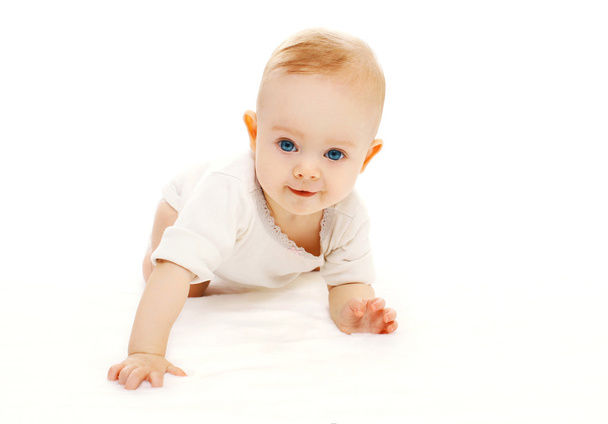 Cute smiling baby crawls on a white background - Фото, изображение