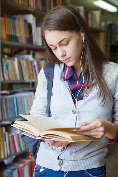 Girl student reads  book - Fotó, kép
