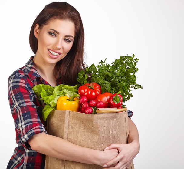 woman with vegetables in bag - Foto, Imagem