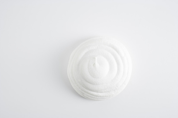 top view of white round meringue on white background - Фото, изображение