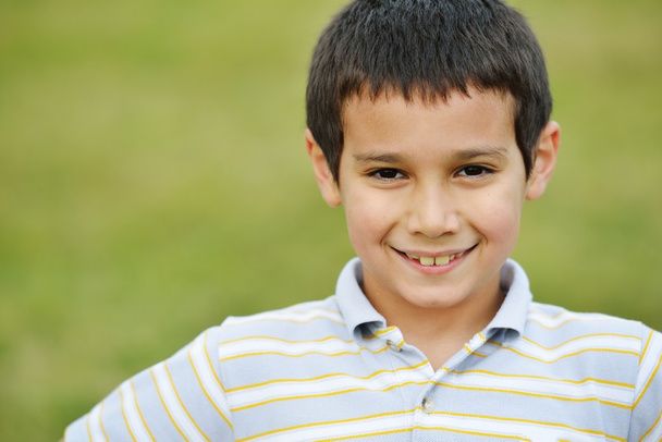 Happy kid on summer grass meadow in nature - Φωτογραφία, εικόνα