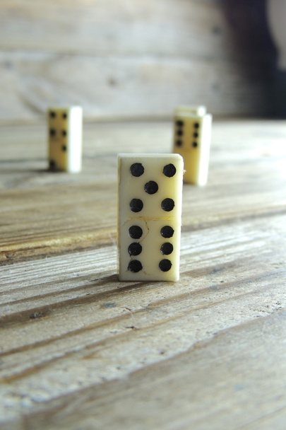 Domino. A bone on wooden background. Game. - Photo, Image