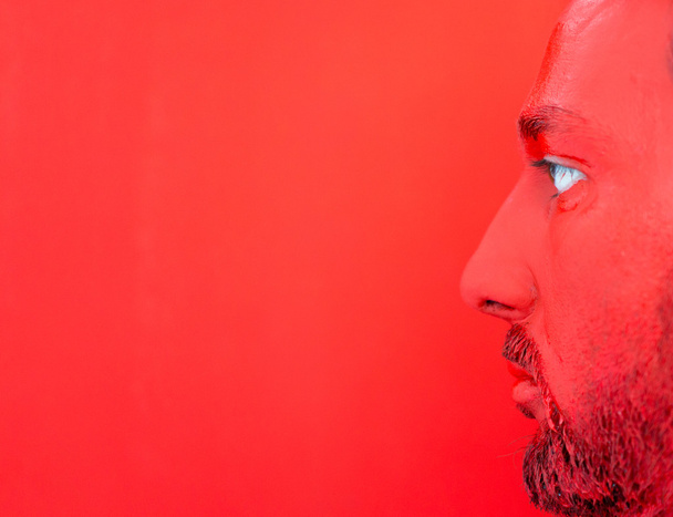 Painting in red man's face - Foto, Bild