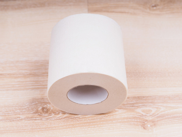 Toilet paper on wooden background - Zdjęcie, obraz