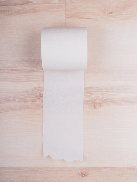 Toilet paper on wooden background - Zdjęcie, obraz