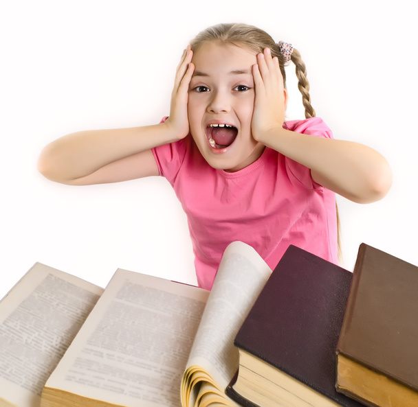Chica con libros de texto sosteniendo su cabeza
 - Foto, imagen