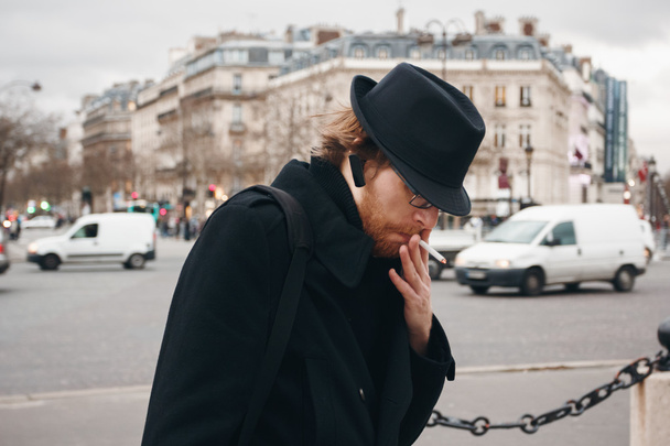 Thoughtful Bearded Man Wearing Hat Smoking  - Valokuva, kuva