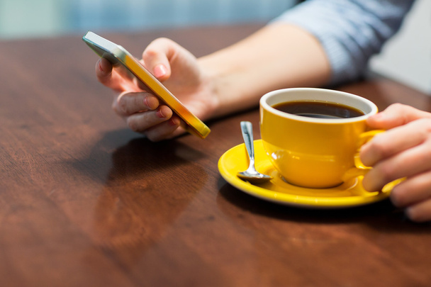 close up of woman with smartphone and coffee - Fotoğraf, Görsel