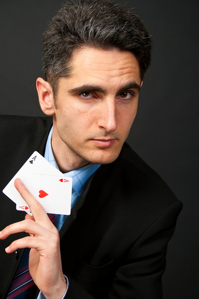 Young lucky gambler with cards - Foto, Imagen