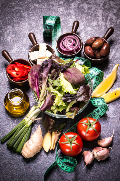 Diet concept, salad ingredients on black background . healthy food - Photo, image