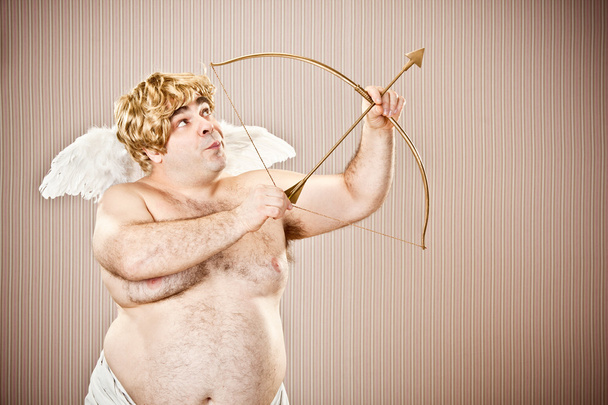 fat blonde cupid with bow and arrow aim for love for Valentine Day - Фото, изображение