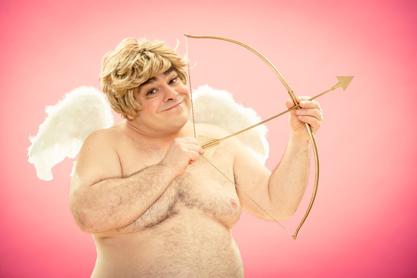 Cupid throws love arrow with his bow for valentine day - Фото, зображення