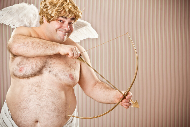 fat blonde cupid with bow and arrow aim for love for Valentine Day - Foto, afbeelding