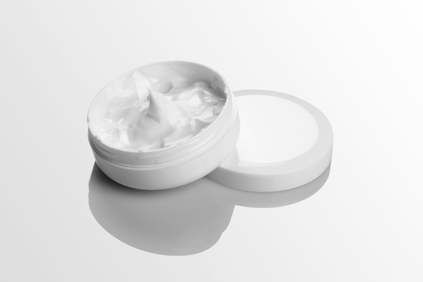 Cosmetic Cream Pack Mockup on white reflective background - Фото, изображение