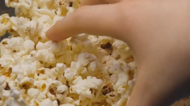Hand is grabbing popcorn. - Footage, Video