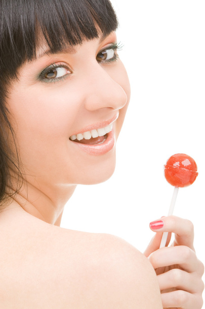 Sweet woman with candy on white background - Foto, Bild