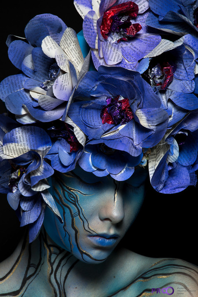 \ girl in blue body art image with colors from Newspapers on the - Fotografie, Obrázek