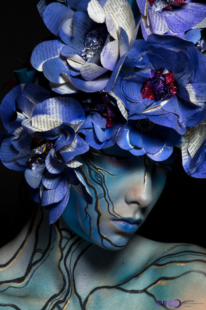 \ girl in blue body art image with colors from Newspapers on the - Foto, Imagen