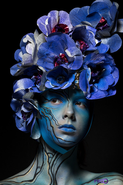 \ girl in blue body art image with colors from Newspapers on the - Fotoğraf, Görsel