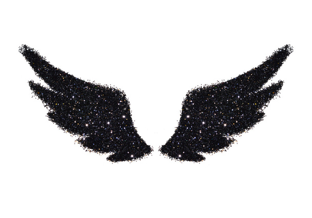 Abstracte vleugels van zwarte glitter op witte achtergrond-interessant en mooi element voor uw ontwerp - Foto, afbeelding