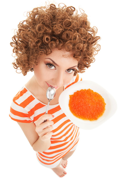 Fun woman eating caviar on the white background - Foto, Imagem
