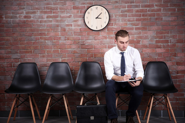 Young businessman sitting on a chair  - Photo, Image