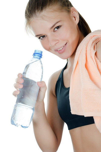 The sports girl with a towel and a water bottle - Fotografie, Obrázek