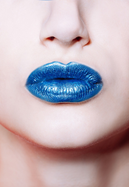 Woman lips with glossy blue lipstick - Foto, afbeelding