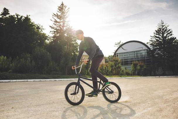 Young BMX bicycle rider - Фото, зображення