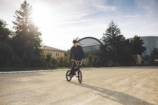 Young BMX bicycle rider - Φωτογραφία, εικόνα