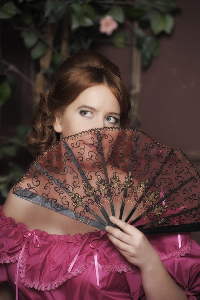 Woman with fan in medieval dress - Photo, Image