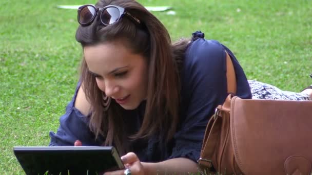 Young woman using tablet computer - Кадри, відео