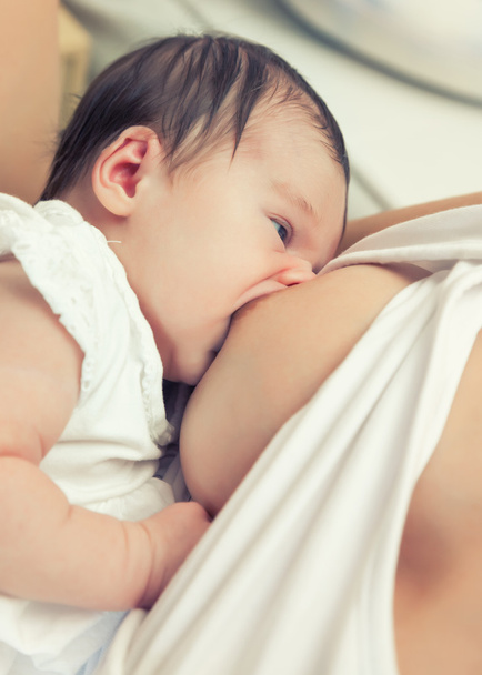 Breastfeeding of infant - 写真・画像