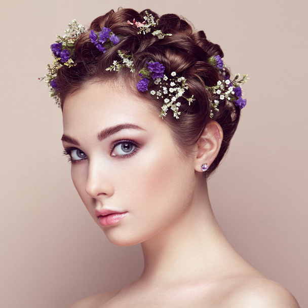 Face of beautiful woman decorated with flowers - Foto, Imagem