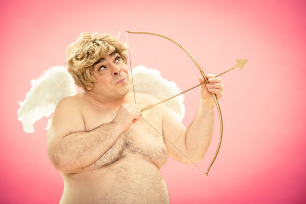 Cupid throws love arrow with his bow for valentine day - Foto, afbeelding