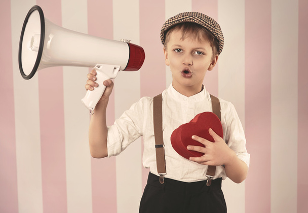 Boy holding red box with megaphone - Photo, Image