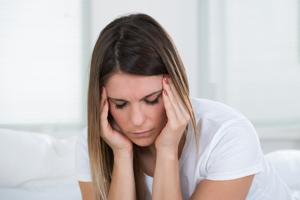 Woman With Headache Holding Head - Фото, изображение