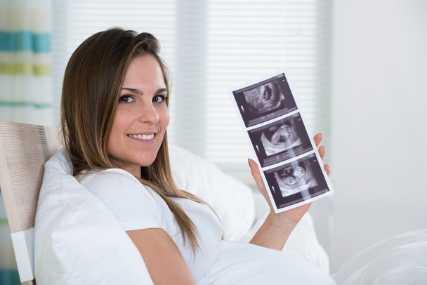 Young Woman Holding Ultrasound Photo - Fotografie, Obrázek