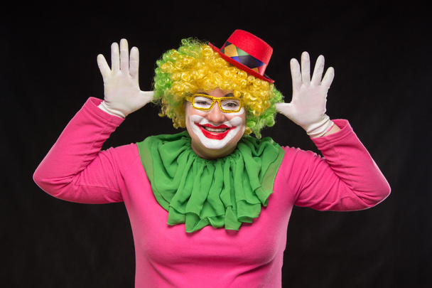 Funny curly clown in shiny glasses with good cheerful emotions - Photo, Image